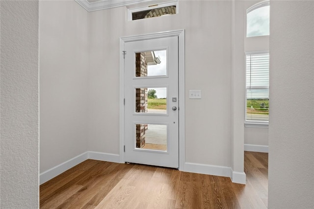 1804 Charles St, Pea Ridge, AR 72751 - entrance foyer featuring wood finished floors and crown molding