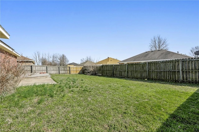 view of yard with a patio and a fenced backyard