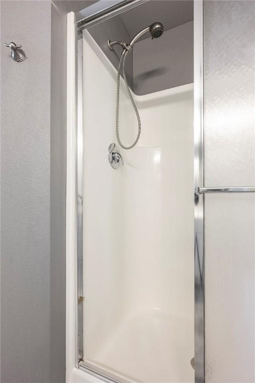 full bathroom with a shower stall