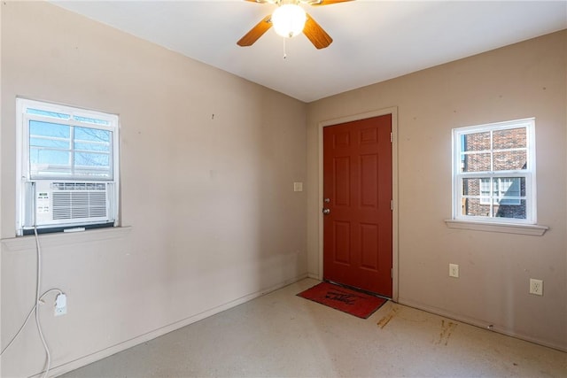 foyer entrance featuring cooling unit and ceiling fan