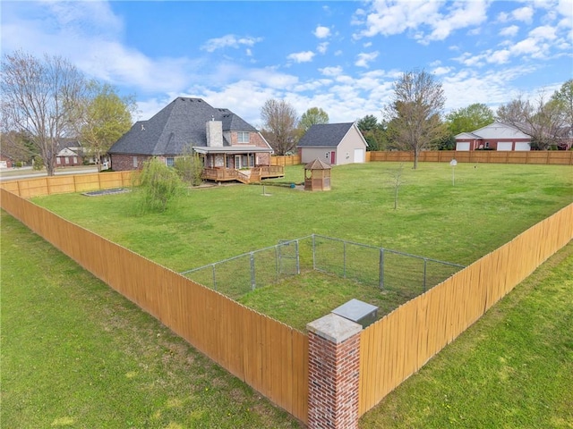 5102 Grove Dr, Rogers, AR 72758 - view of yard with a fenced backyard, a storage unit, an outbuilding, and a deck