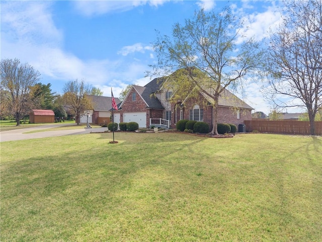 5102 Grove Dr, Rogers, AR 72758 - view of front facade with a garage, a front lawn, fence, and concrete driveway