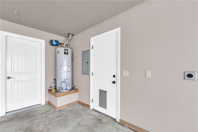 garage with water heater, baseboards, and electric panel