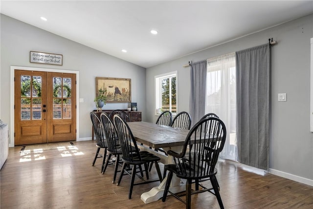 dining area with baseboards, lofted ceiling, recessed lighting, french doors, and wood finished floors