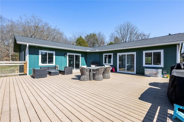 deck with outdoor dining space and an outdoor living space