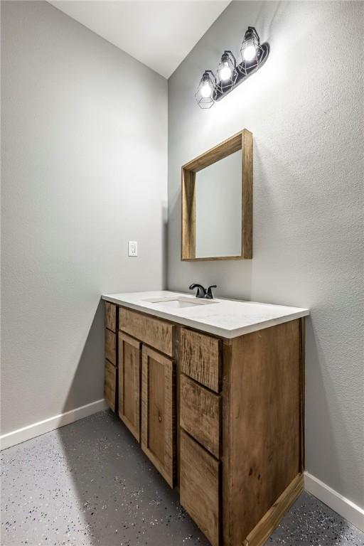 bathroom featuring vanity and baseboards