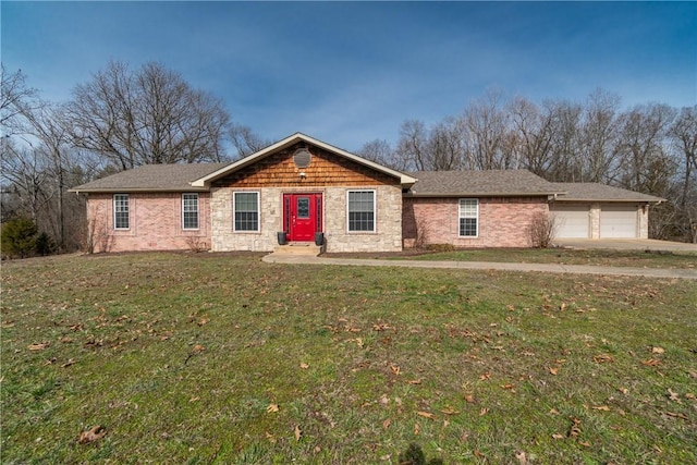 ranch-style house with an attached garage and a front lawn