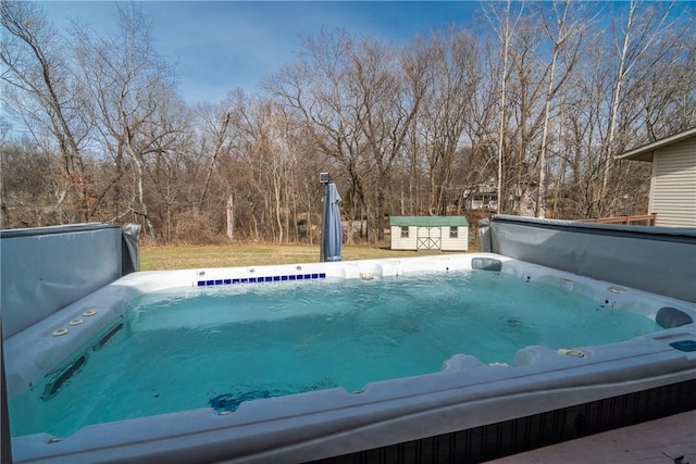 view of swimming pool with a storage shed, an outdoor structure, and a covered hot tub