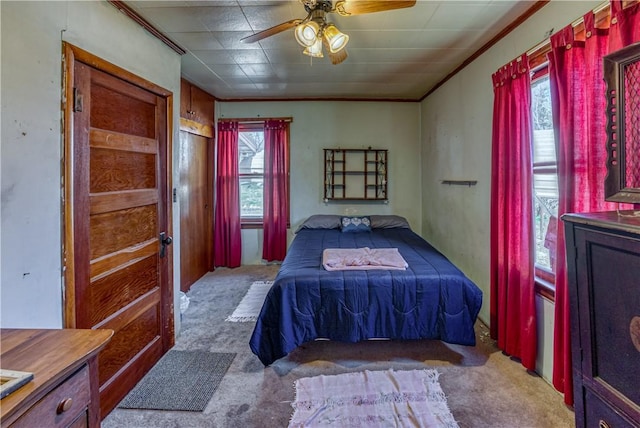 carpeted bedroom with a ceiling fan