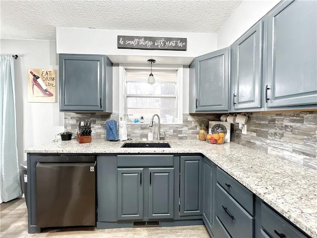 kitchen with visible vents, a sink, tasteful backsplash, fridge, and dishwasher