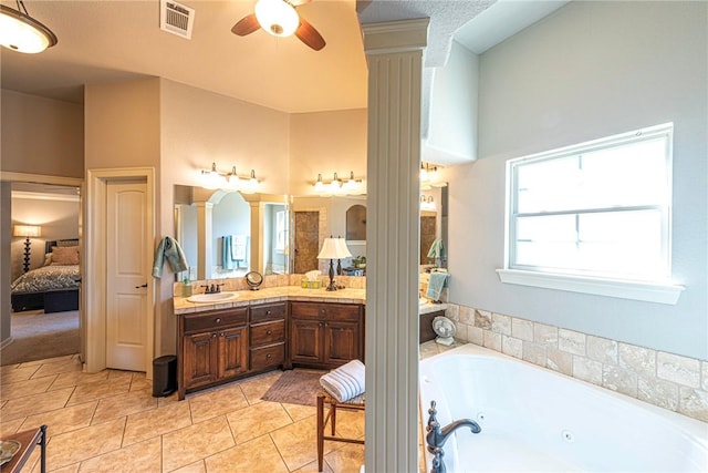 bathroom featuring tile patterned flooring, visible vents, vanity, a whirlpool tub, and ensuite bath