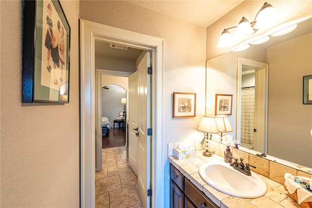 full bath featuring vanity and visible vents