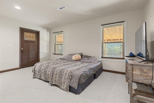 bedroom featuring visible vents and baseboards