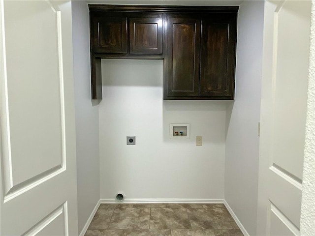 clothes washing area with hookup for a washing machine, cabinet space, baseboards, and electric dryer hookup