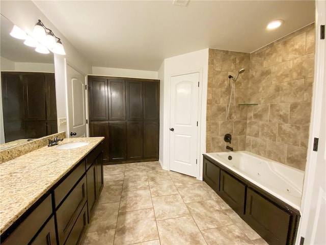 full bathroom with tile patterned flooring, vanity, and shower / bathtub combination