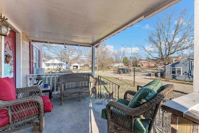 view of patio with a residential view and a porch