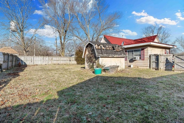 exterior space with cooling unit and a fenced backyard