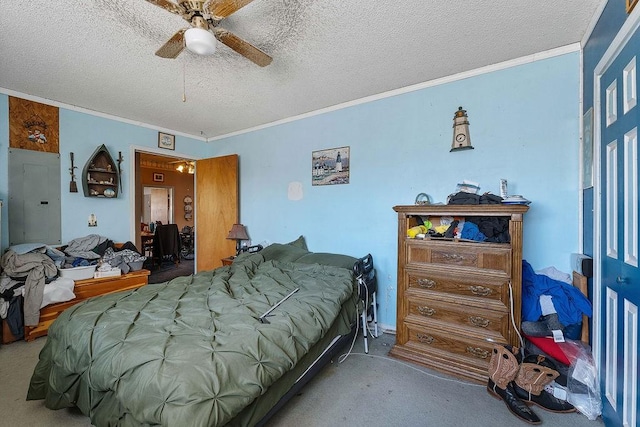 carpeted bedroom featuring a textured ceiling, crown molding, and a ceiling fan