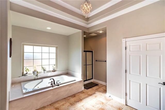 bathroom featuring a tub with jets, baseboards, a stall shower, ornamental molding, and a chandelier