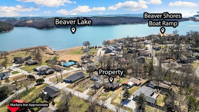 birds eye view of property featuring a water view and a residential view