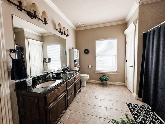 bathroom featuring a sink, a healthy amount of sunlight, and ornamental molding