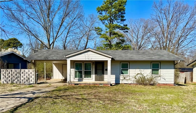 view of front facade with a front lawn, driveway, covered porch, crawl space, and a carport