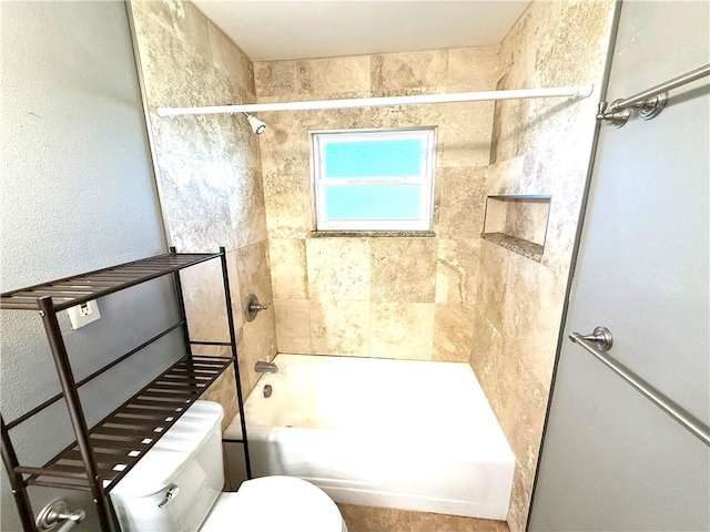 bathroom with toilet and  shower combination