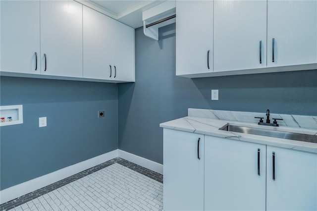 washroom featuring hookup for a washing machine, baseboards, cabinet space, a sink, and electric dryer hookup