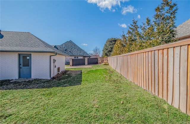 view of yard with a fenced backyard