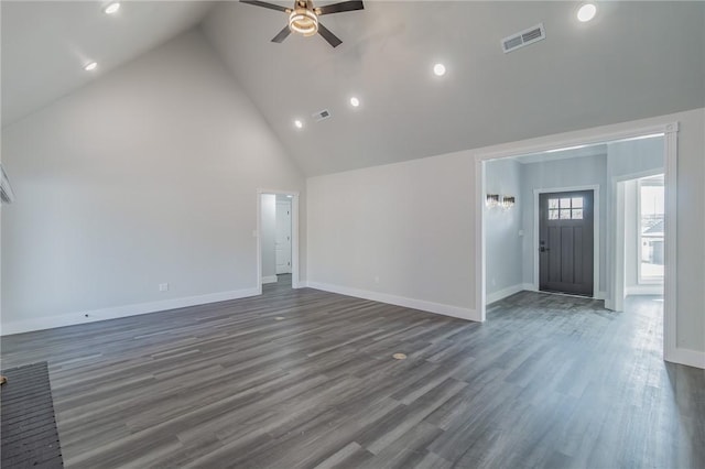 unfurnished living room featuring a ceiling fan, wood finished floors, visible vents, and high vaulted ceiling