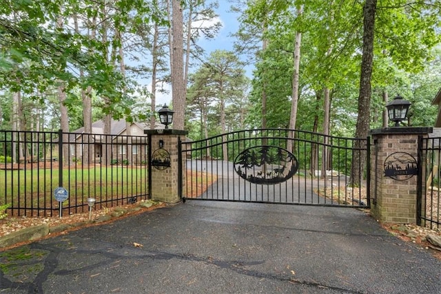 view of gate featuring fence