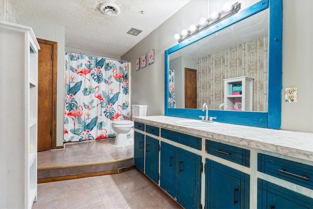 bathroom with visible vents, toilet, vanity, a shower with curtain, and a textured ceiling