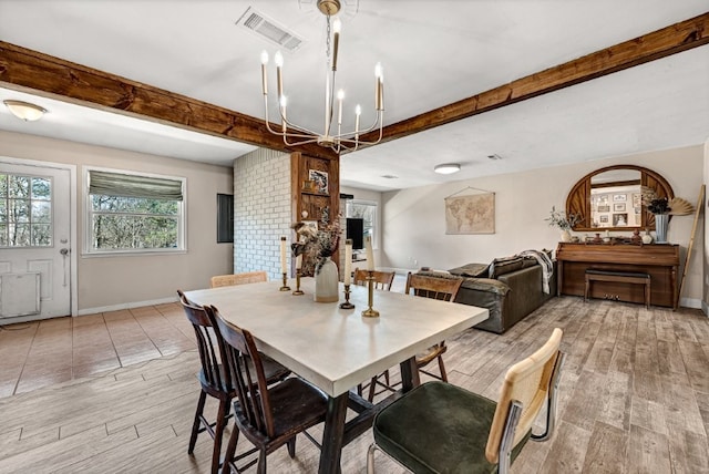 dining space featuring beamed ceiling, light wood-style floors, visible vents, and baseboards