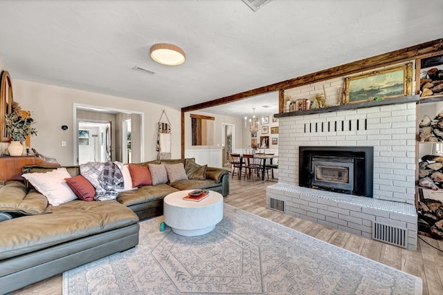 living room featuring wood finished floors and visible vents