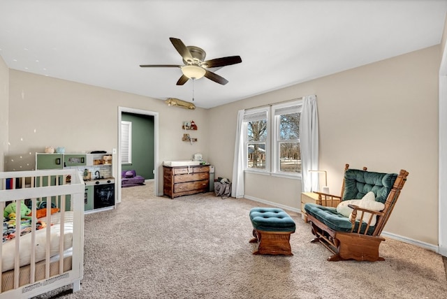 carpeted bedroom with baseboards and ceiling fan