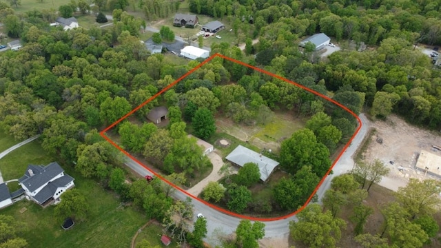 drone / aerial view featuring a view of trees