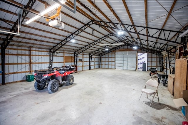 garage with metal wall and a garage door opener