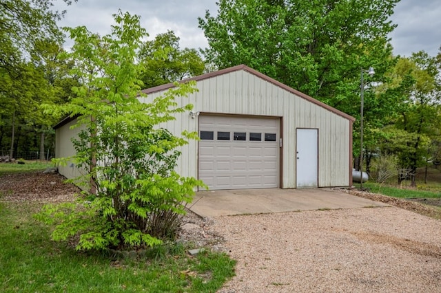 detached garage featuring driveway