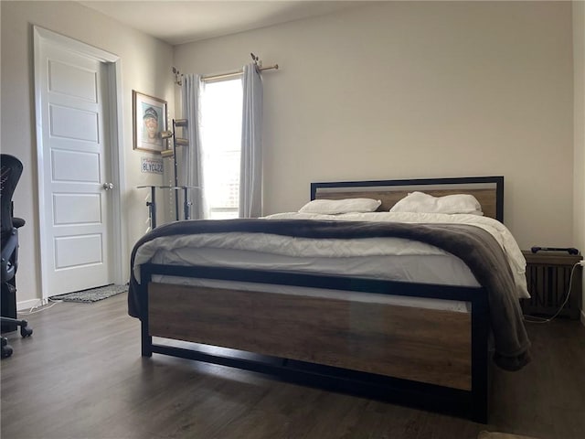 bedroom featuring wood finished floors