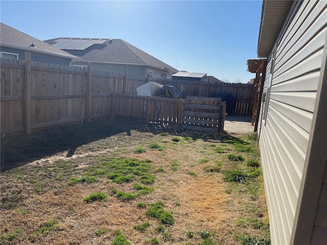 view of yard with a fenced backyard