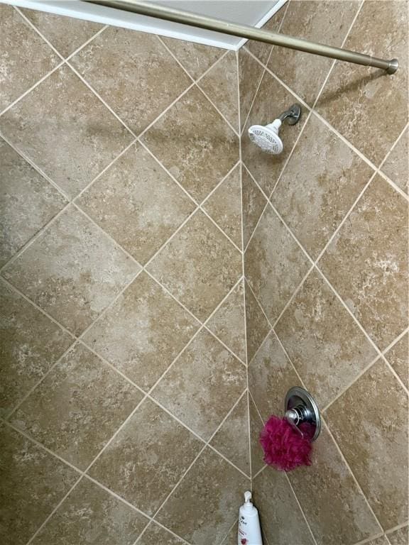 details with a tile shower