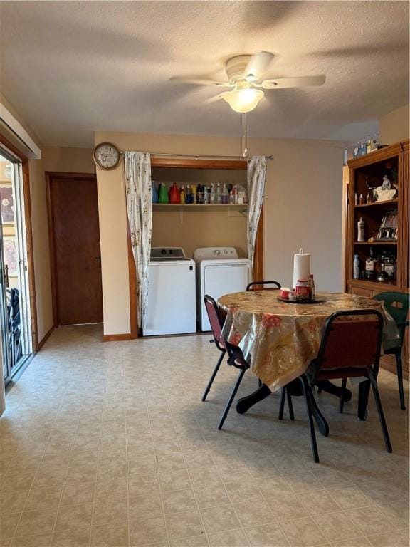 dining area featuring ceiling fan, washing machine and dryer, baseboards, and a textured ceiling