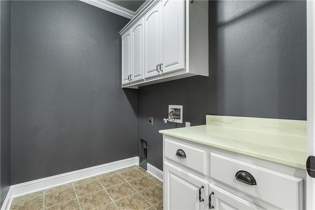 laundry area featuring electric dryer hookup, tile patterned floors, washer hookup, cabinet space, and baseboards