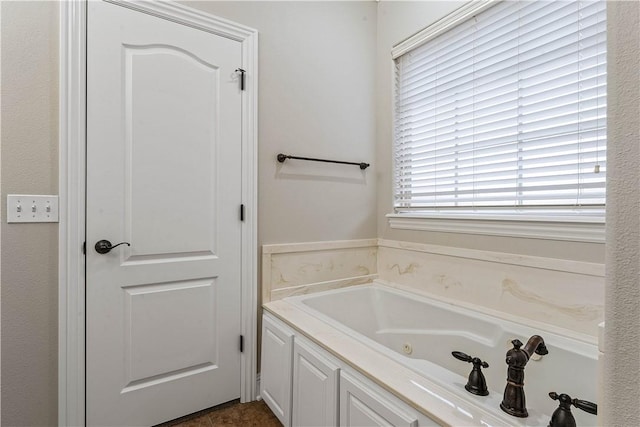 full bathroom with a jetted tub