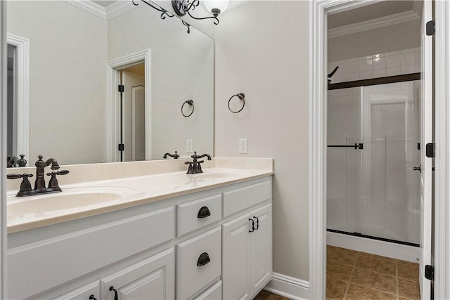 full bath featuring crown molding, a stall shower, and a sink