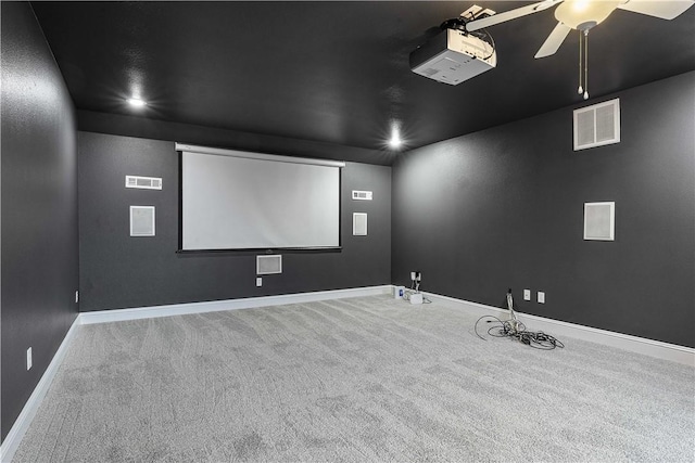 carpeted cinema room with visible vents, recessed lighting, a ceiling fan, and baseboards