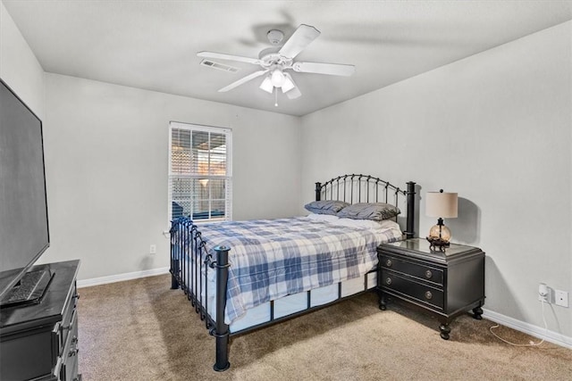 carpeted bedroom with baseboards, visible vents, and ceiling fan