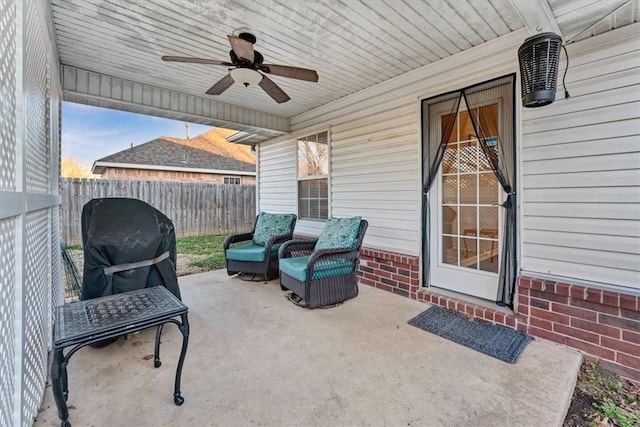 view of patio / terrace featuring fence private yard and a ceiling fan