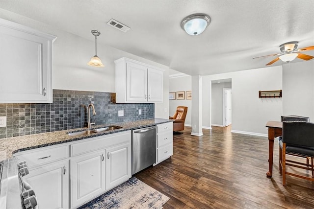 kitchen with visible vents, dark wood-style flooring, a sink, white cabinets, and appliances with stainless steel finishes