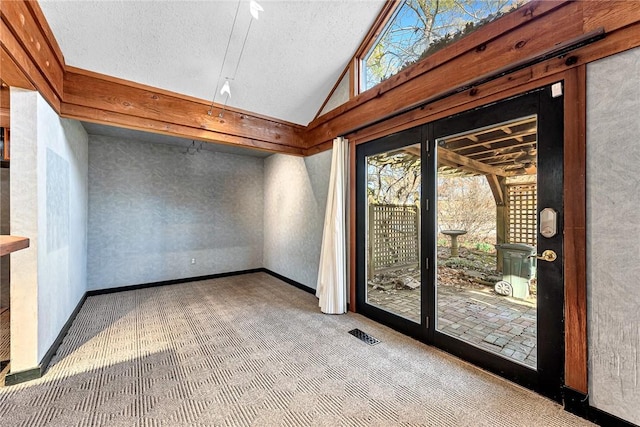 unfurnished sunroom with lofted ceiling and visible vents